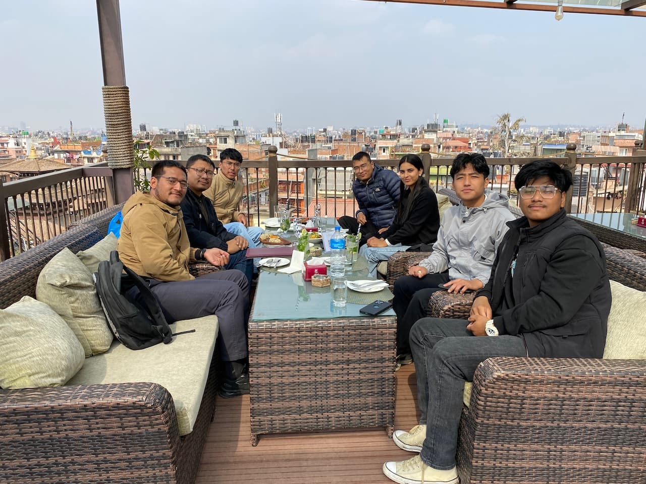 Team farewell dinner on a Kathmandu rooftop